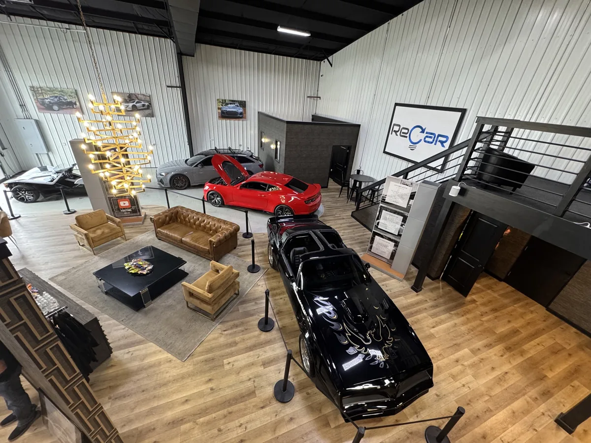 ReCar showroom floor with vehicles on display around the customer lounge