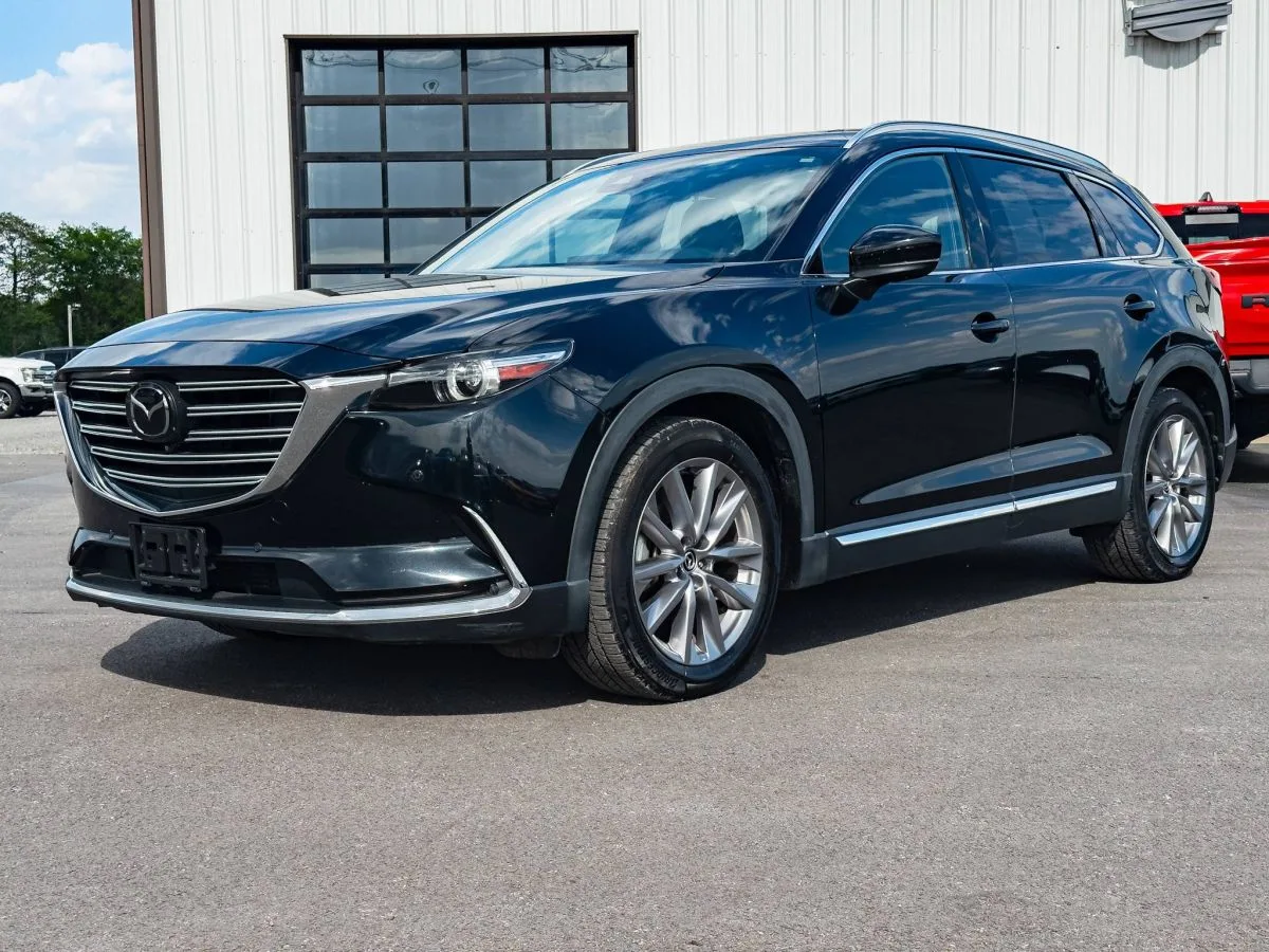 Black Mazda CX-9 SUV parked in front of the ReCar building in Benton, Missouri