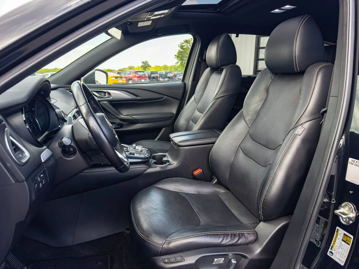 Front leather seats and interior of a Mazda CX-9 at ReCar, photographed for its listing